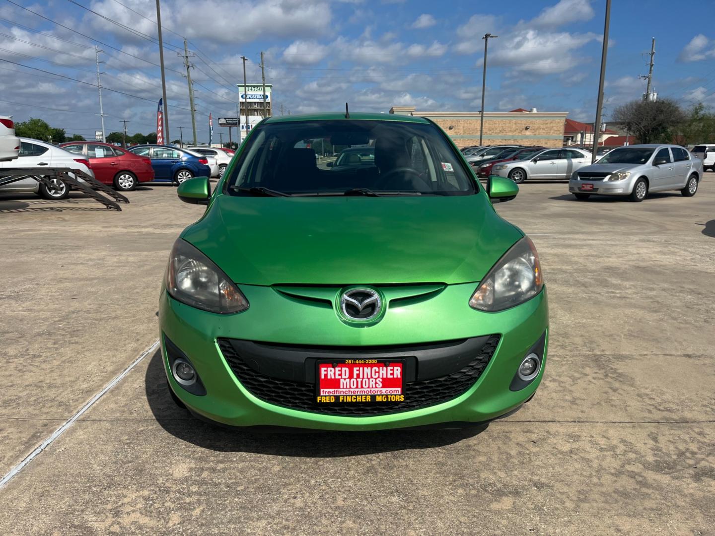 2013 green /black Mazda MAZDA2 Touring (JM1DE1LY1D0) with an 1.5L L4 DOHC 16V engine, Automatic transmission, located at 14700 Tomball Parkway 249, Houston, TX, 77086, (281) 444-2200, 29.928619, -95.504074 - Photo#1